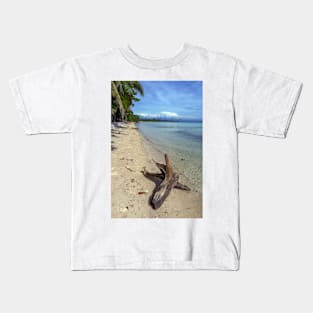 driftwood on the beach Kids T-Shirt